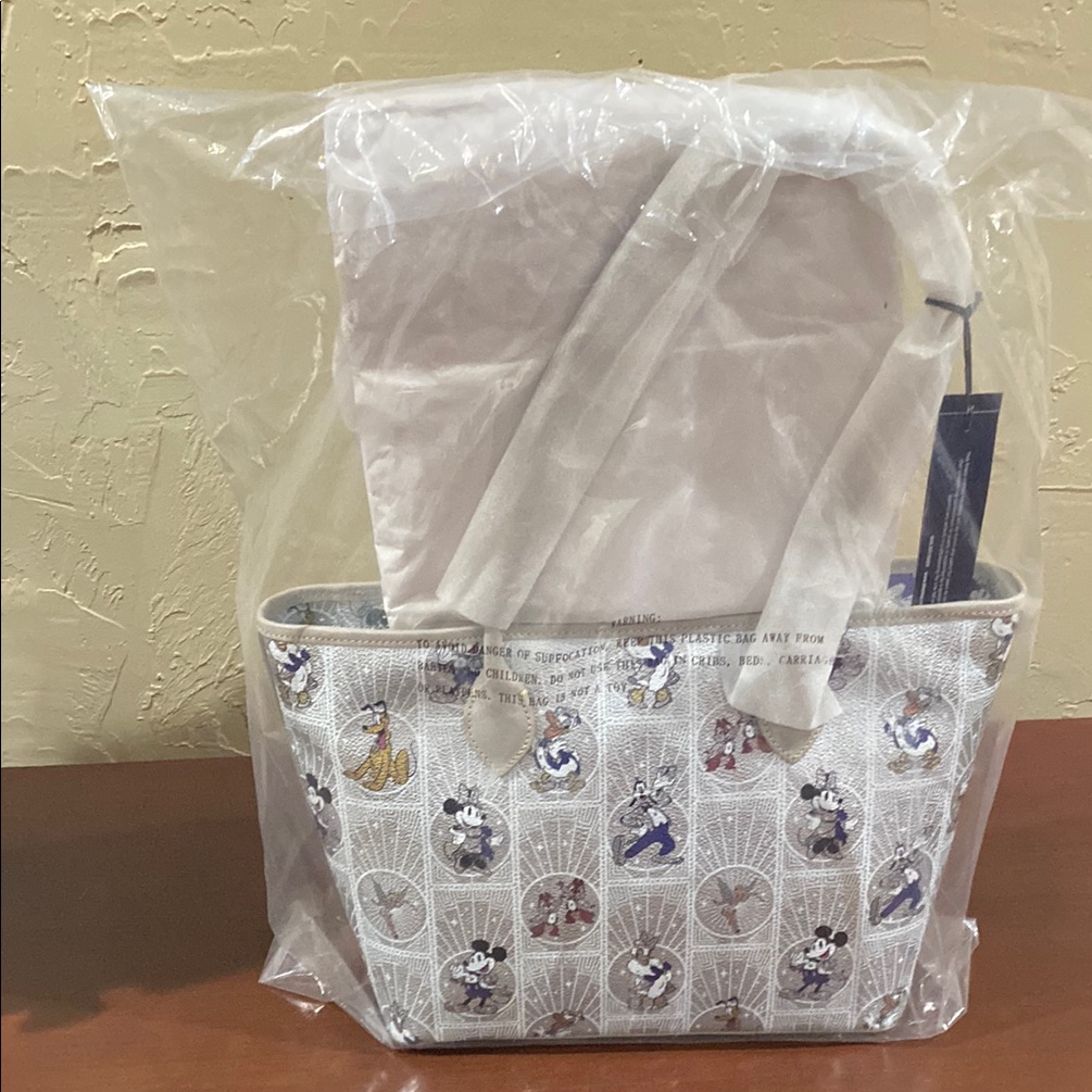 Dooney & Bourke Cream Tote Bag Artistic Design